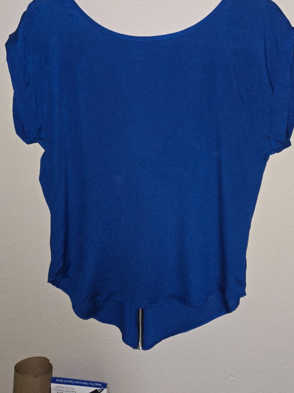Cool top with jazzy back zip.  Cap sleeve. Medium